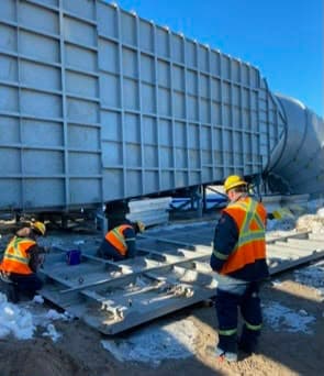 Local 512 members field-fabricating a large sheet metal plenum on site